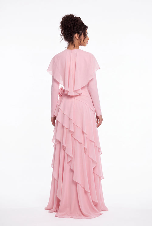 Back view of the Athera blush pink chiffon gown showing the short cape and cascading ruffle tiers