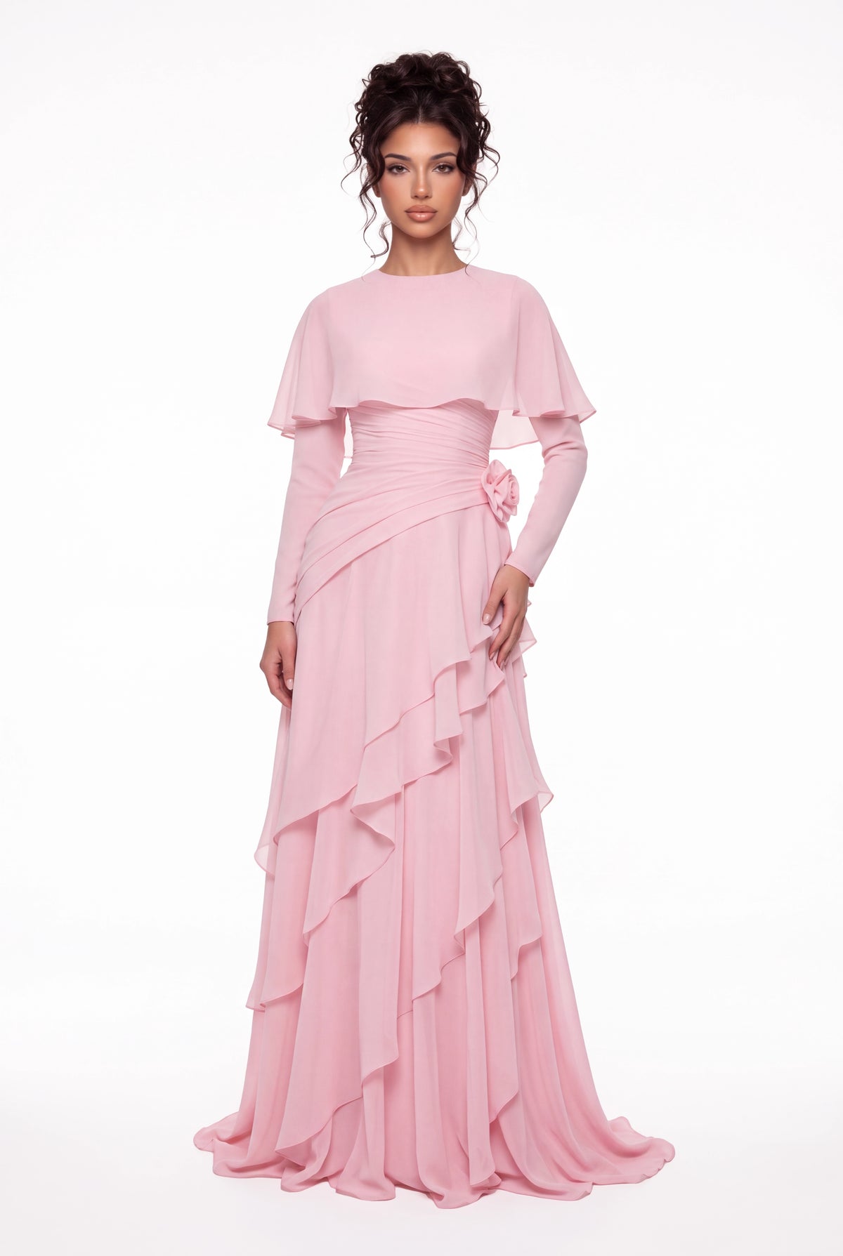 Model wearing the Athera blush pink chiffon cape gown with long sleeves, full-length front view