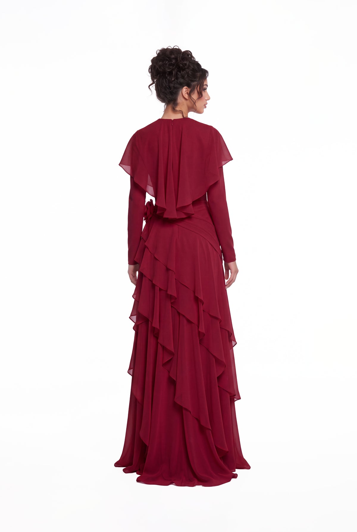 Back view of the Athera burgundy red chiffon gown showing the short cape and cascading ruffle tiers