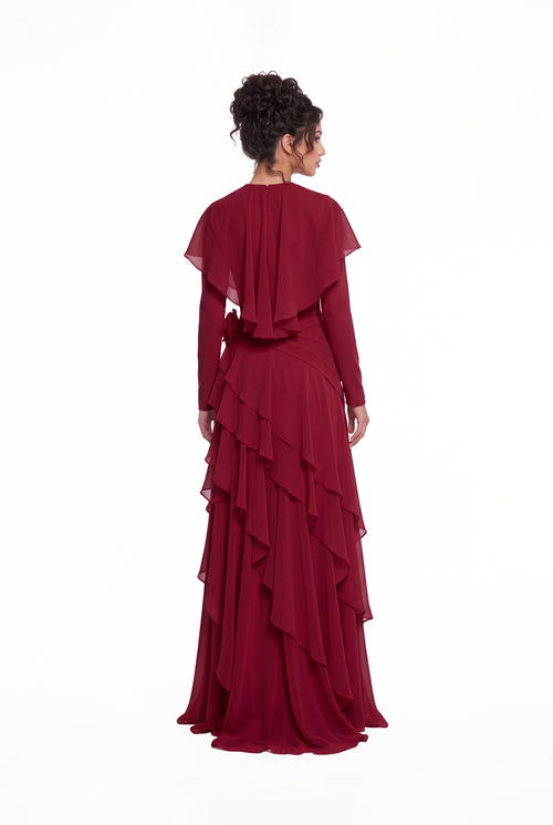 Back view of the Athera burgundy red chiffon gown showing the short cape and cascading ruffle tiers