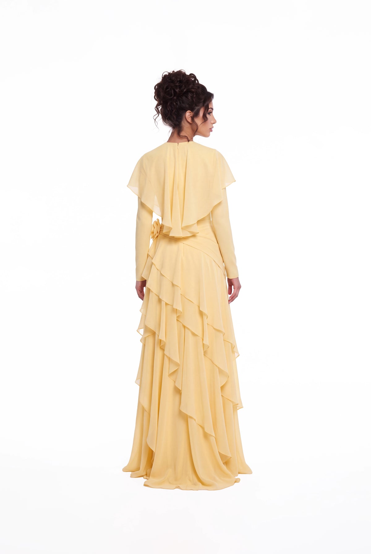 Back view of the Athera butterfly yellow chiffon gown showing the short cape and ruffle tiers