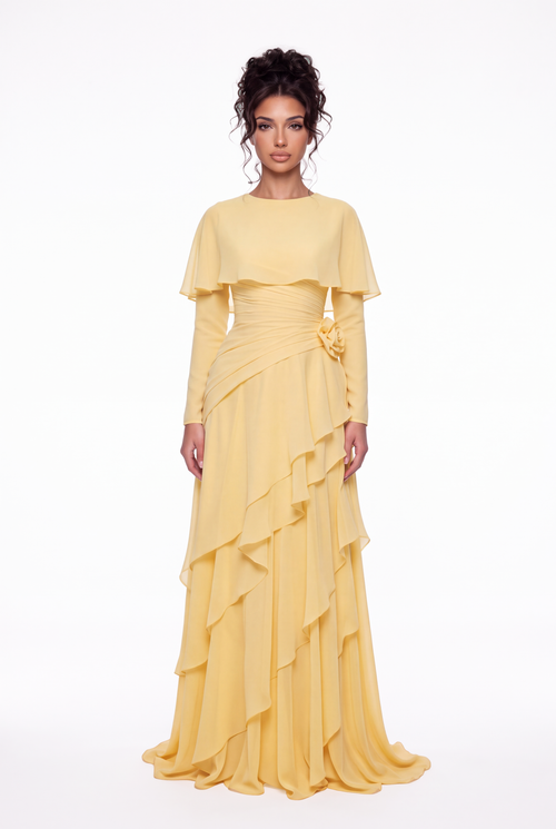 Model wearing the Athera butterfly yellow chiffon cape gown with long sleeves, full-length front view