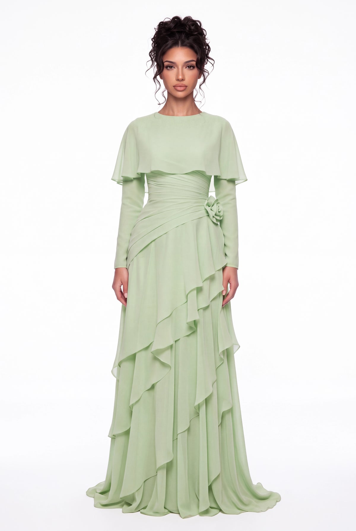 Model wearing the Athera sage green chiffon cape gown with long sleeves, full-length front view