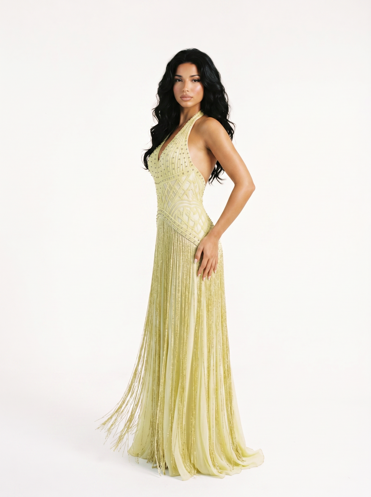Model wearing the Auréa pale lemon hand-beaded fringe gown, three-quarter view