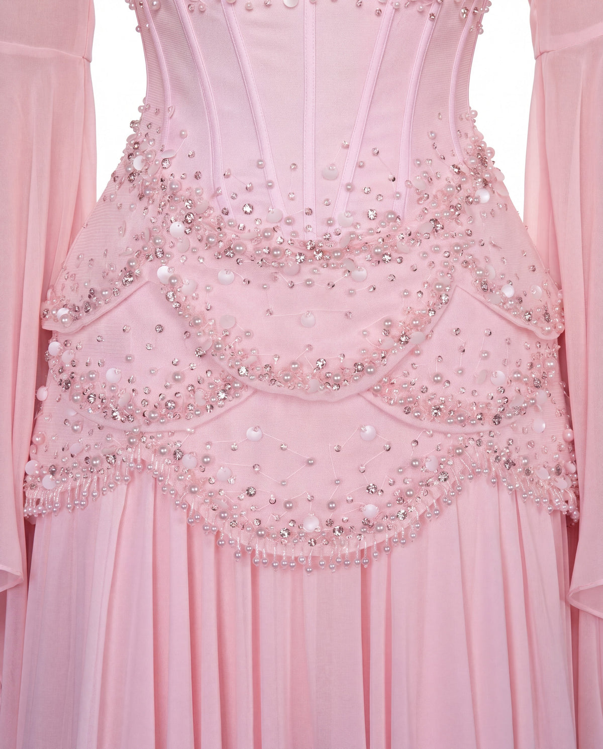 Detail of the scalloped beaded hip layers and crystal fringe on the Azura baby pink gown
