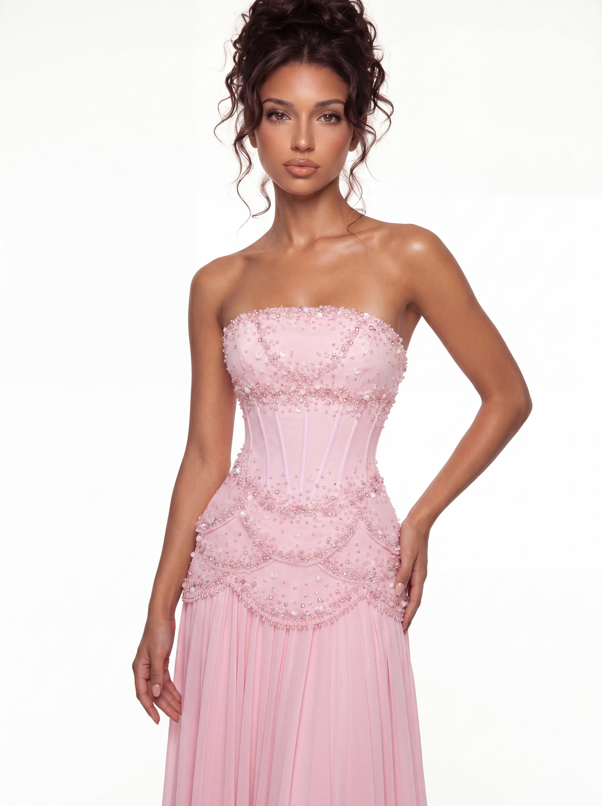 The Azura baby pink gown worn strapless with the sleeves removed, front view