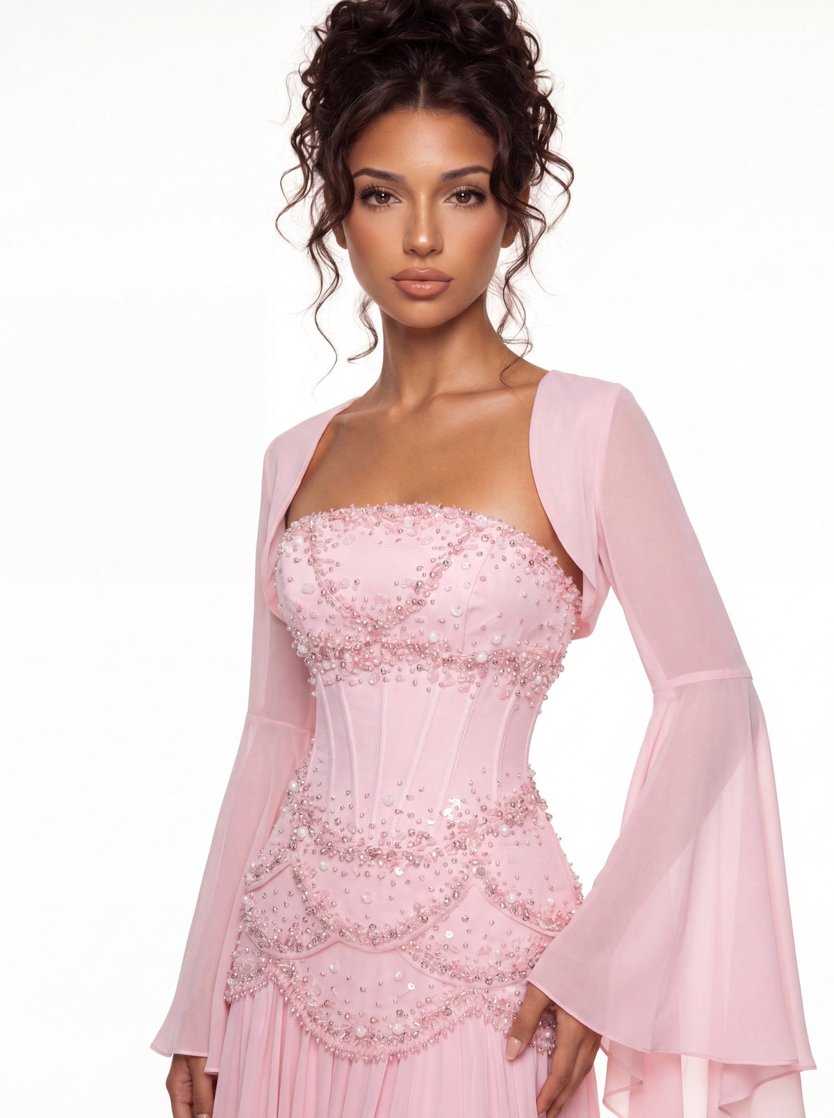 Three-quarter view of the Azura baby pink gown with detachable bell sleeves